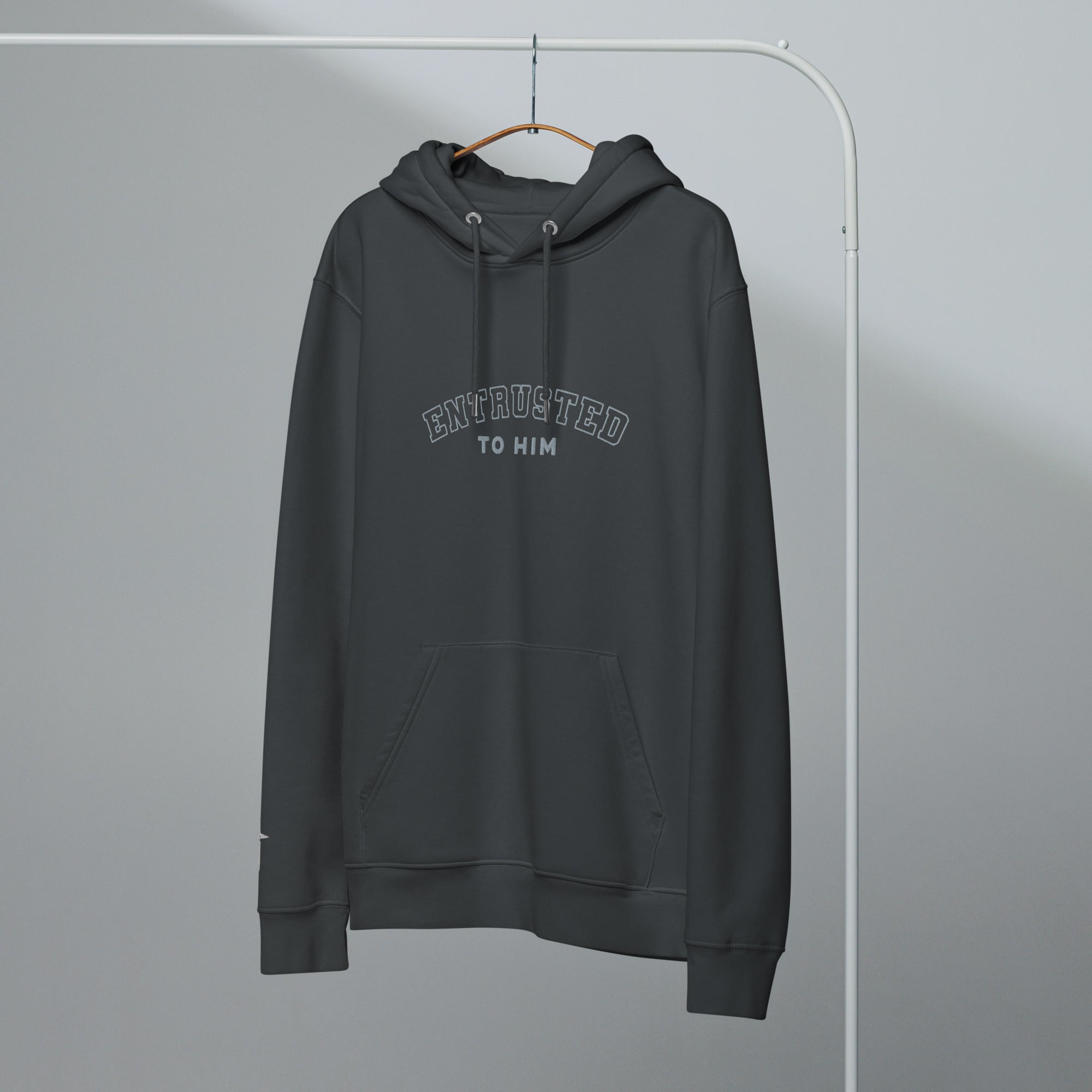 Image of Entrusted Varsity Christian hoodie india ink grey front lifestyle view — Entrusted to Him